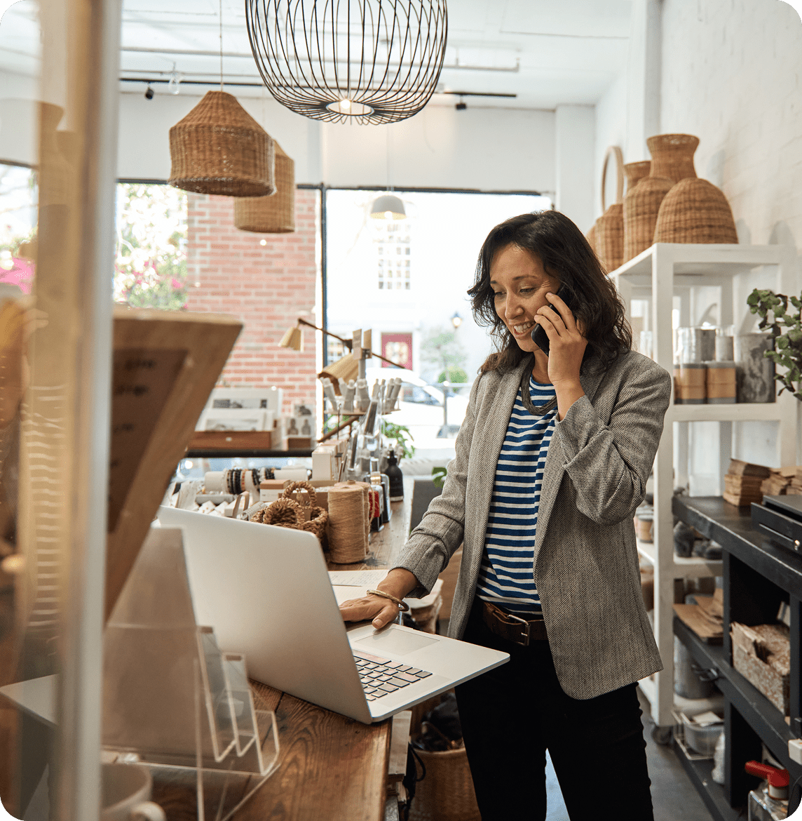 Retail owner using laptop